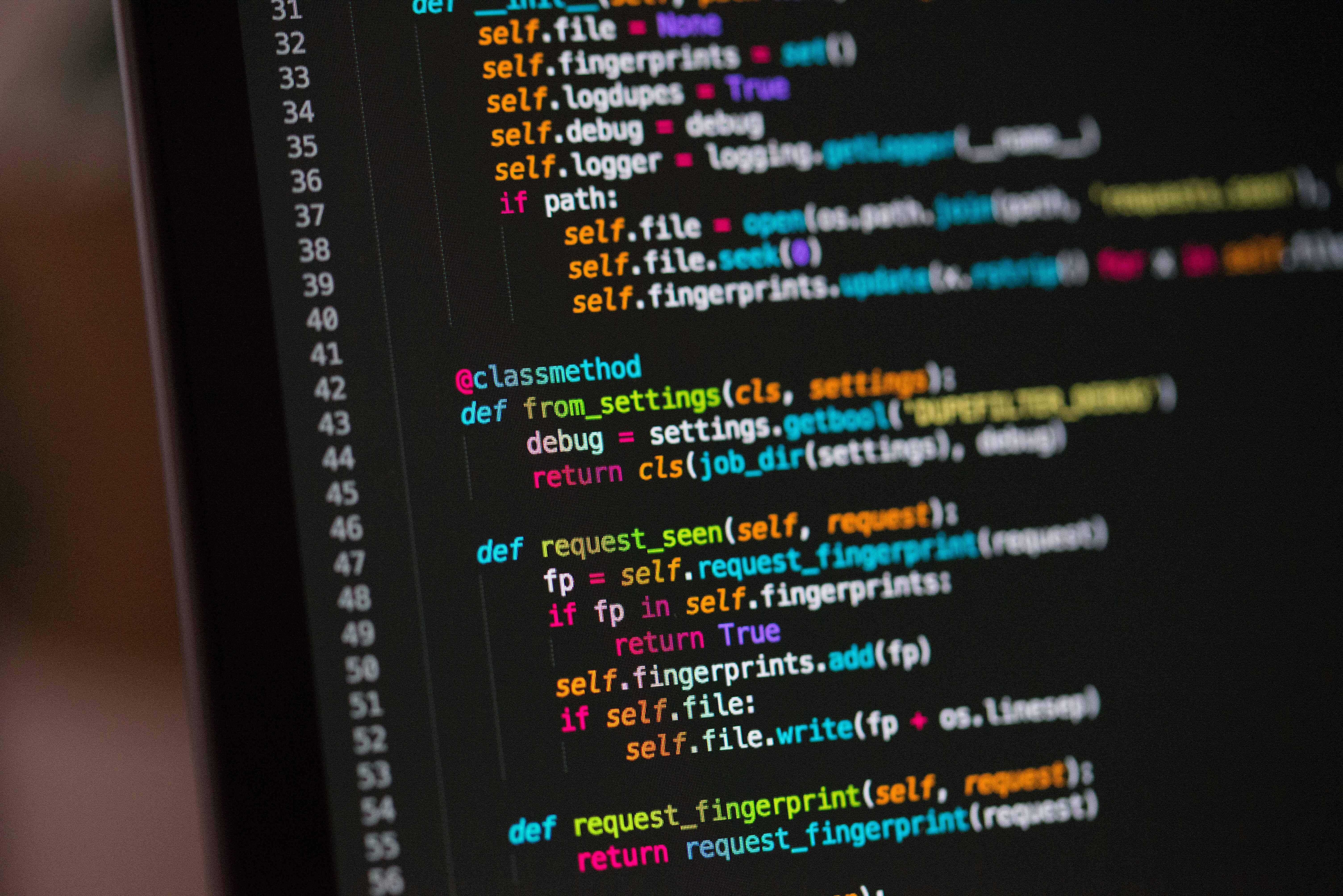 a computer screen with a bunch of code on it; Credit: @Chris Ried on Unsplash